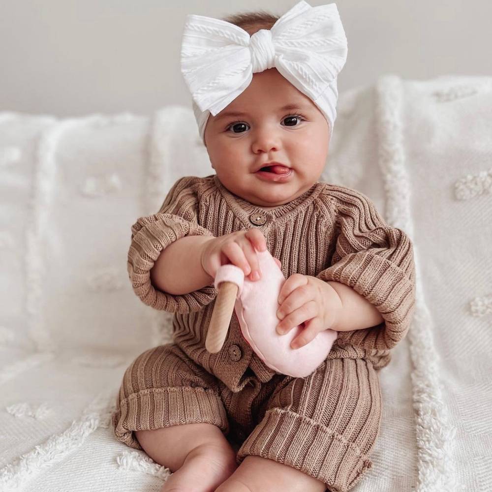 Bowie Double Bow Baby Headband in White — baby headband close-up showing nylon