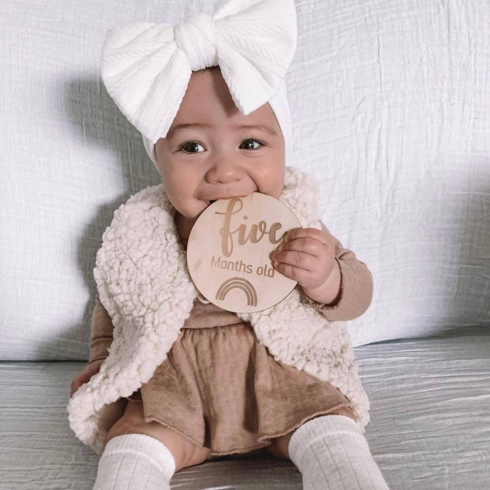 Bowie Double Bow Baby Headband in White — white baby headband product styling