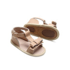 Baby feet in baby sandals on soft surface — Pale Pecan Leather Baby Bow Sandal