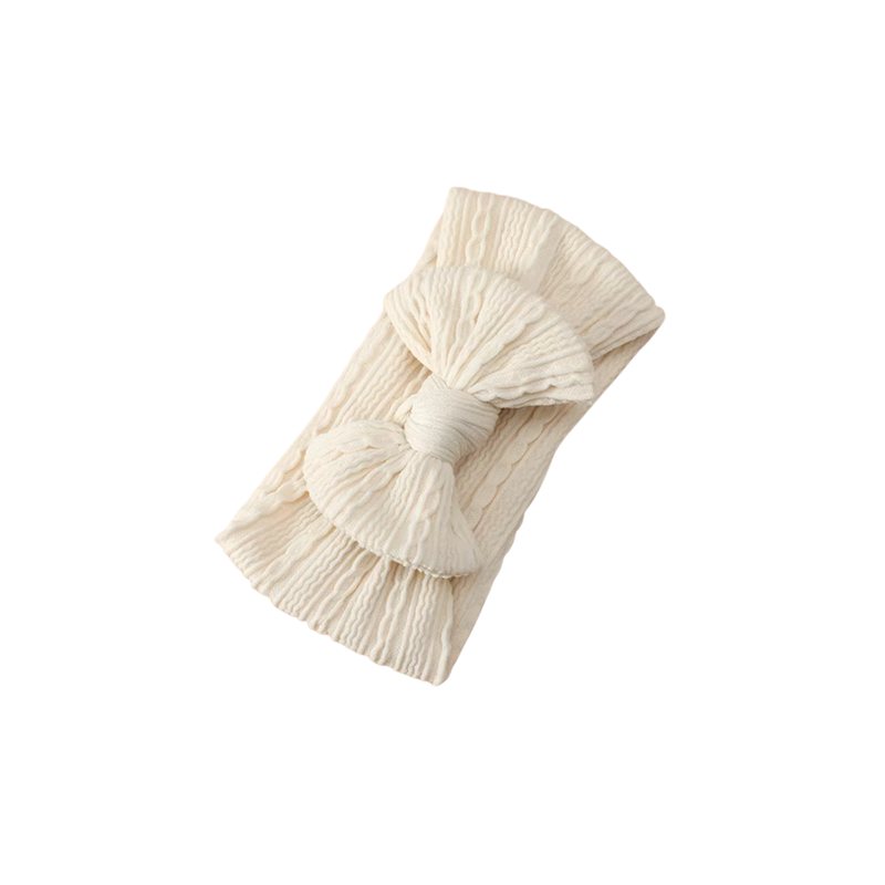 Sand-coloured waffle knit baby headband with large top knot bow for newborns and toddlers