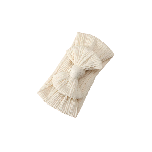 Sand-coloured waffle knit baby headband with large top knot bow for newborns and toddlers