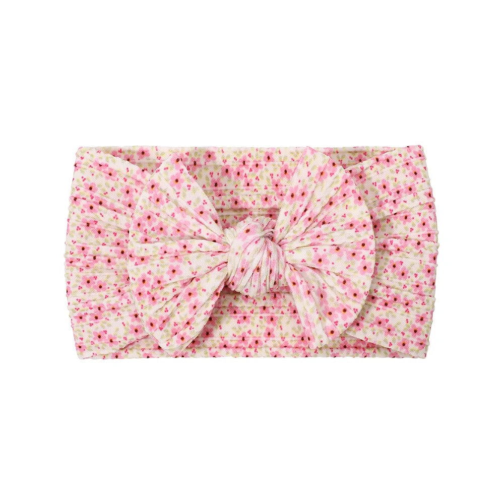 Cable knit floral baby headband with bow detail — Single Bow Cable Knit Baby Headband Floral Design #10 on white background