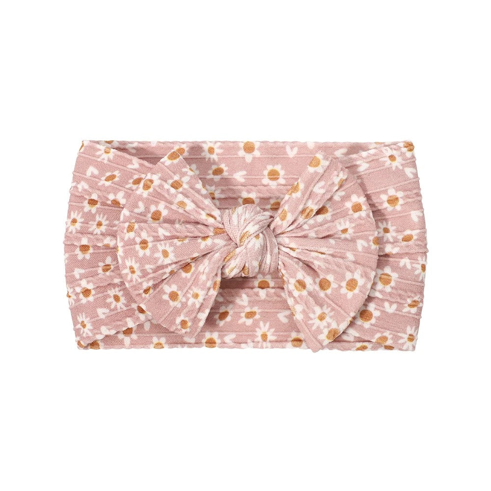 Cable knit floral baby headband with bow detail — Single Bow Cable Knit Baby Headband Floral Design #4 on white background