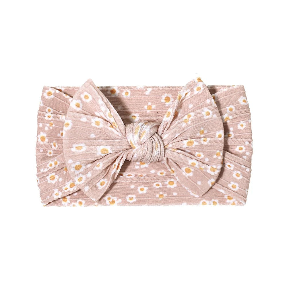 Cable knit floral baby headband with bow detail — Single Bow Cable Knit Baby Headband Floral Design #5 on white background