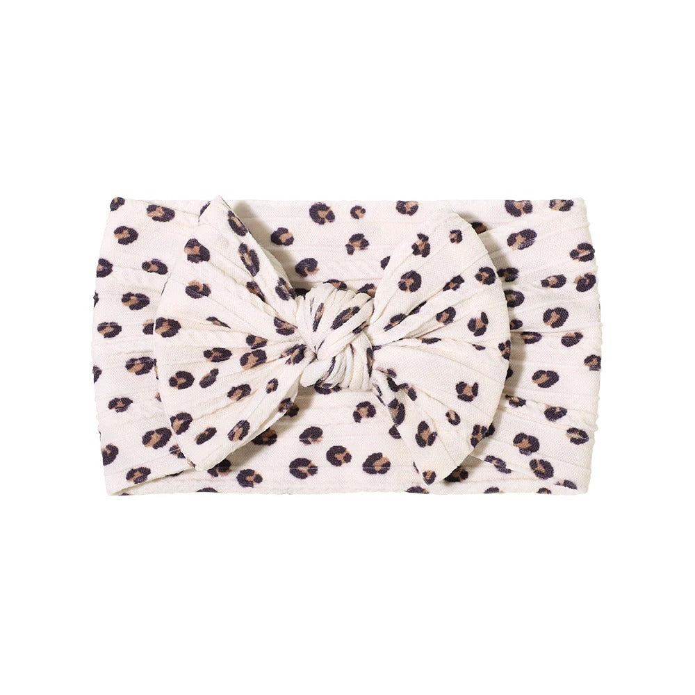 Cable knit floral baby headband with bow detail — Single Bow Cable Knit Baby Headband Floral Design #9 on white background