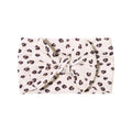 Cable knit floral baby headband with bow detail — Single Bow Cable Knit Baby Headband Floral Design #9 on white background