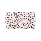 Cable knit floral baby headband with bow detail — Single Bow Cable Knit Baby Headband Floral Design #9 on white background
