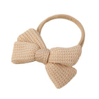 Latte knit baby headband — Baby Knitted Bow Headband on white background