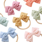 Little Embroidered Cotton Baby Bow in Fairy Floss — close-up of embroidered on fairy floss baby accessory