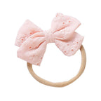 Fairy floss cotton embroidered baby accessory — Little Embroidered Cotton Baby Bow on white background