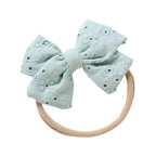 Teal cotton embroidered baby accessory — Little Embroidered Cotton Baby Bow on white background