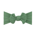 Fern green nylon ear detail baby headband with bow detail — Bowie Single Bow Headband on white background