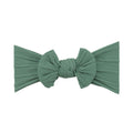 Forest green nylon ear detail baby headband with bow detail — Bowie Single Bow Headband on white background
