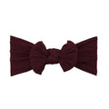 Magenta red nylon ear detail baby headband with bow detail — Bowie Single Bow Headband on white background
