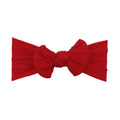 Strawberry red nylon ear detail baby headband with bow detail — Bowie Single Bow Headband on white background