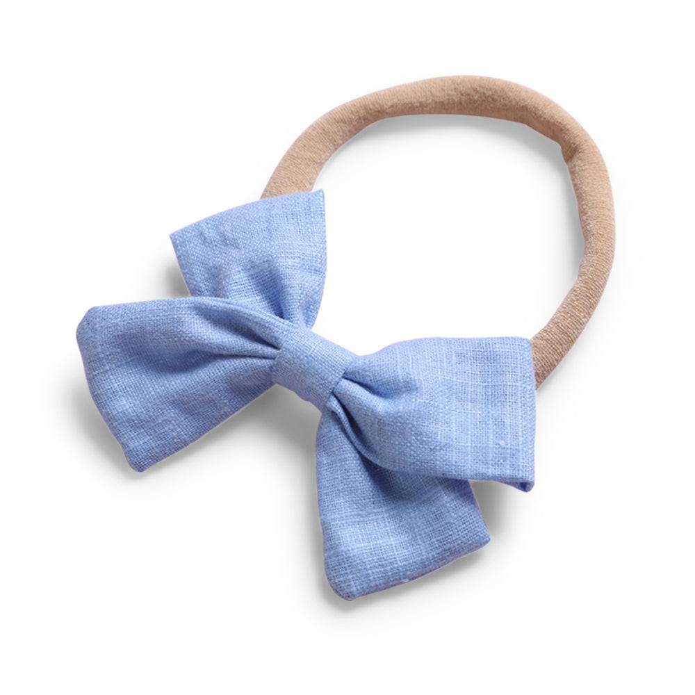 Cornflower blue cotton floral baby hat — Tinka Tiny Bow on white background