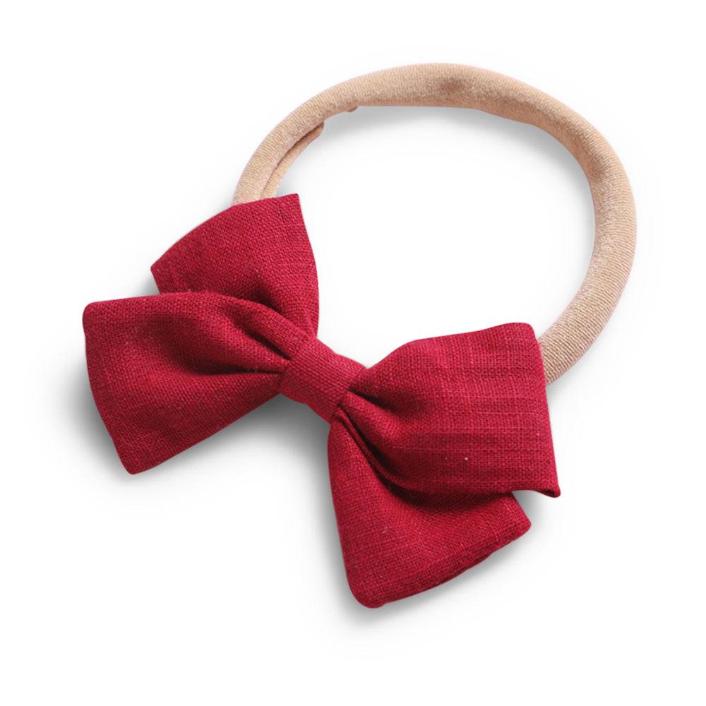 Cherry red cotton baby hat — Tinka Tiny Bow on white background