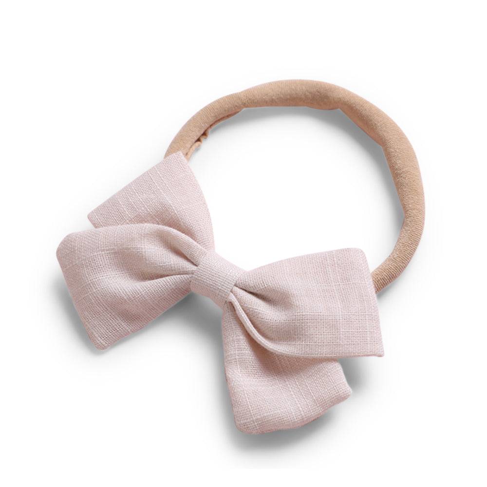 Ivory cotton baby hat — Tinka Tiny Bow on white background