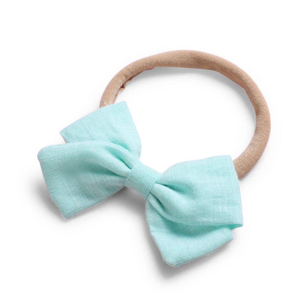 Mint cotton baby hat — Tinka Tiny Bow on white background