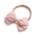 Peach cotton baby hat — Tinka Tiny Bow on white background