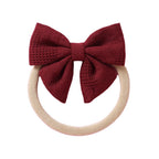 Cherry knit textured baby headband with bow detail — Baby Small Waffle Bow Headband on white background