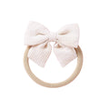 Ivory knit textured baby headband with bow detail — Baby Small Waffle Bow Headband on white background