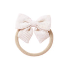 Ivory knit textured baby headband with bow detail — Baby Small Waffle Bow Headband on white background