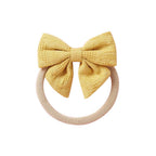 Mustard knit textured baby headband with bow detail — Baby Small Waffle Bow Headband on white background