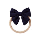 Navy knit textured baby headband with bow detail — Baby Small Waffle Bow Headband on white background