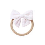 White knit textured baby headband with bow detail — Baby Small Waffle Bow Headband on white background