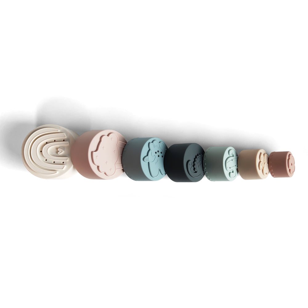 Silicone Baby Stacking Cups Bath & Beach in Pastel — baby hat size and scale reference