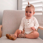Cheetah Calf Hair Leather Baby T Bar Shoe — baby shoes styled flat lay with nursery accessories