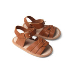 Baby feet in baby sandals on soft surface — Gingerbread Weave Leather Baby Sandal
