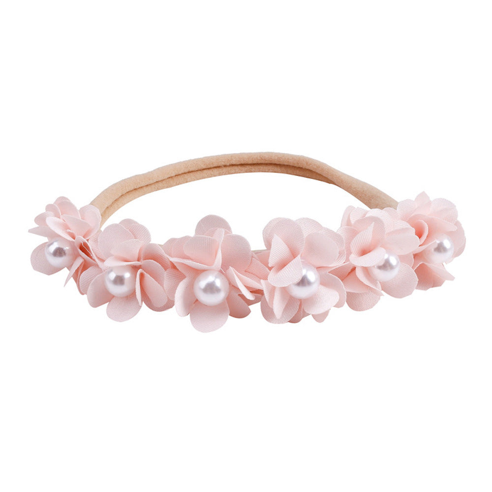 Lace floral baby headband — Delicate Baby Flower Crown with Pearls: Soft Shell Pink Flower Girl Headband on white background