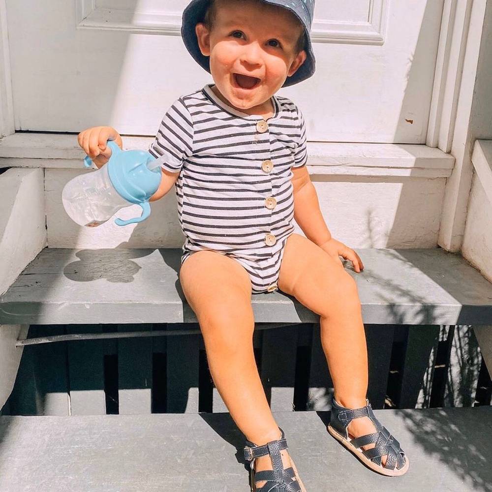 Zodiac Blue Leather Baby Sandal — baby sandals styled flat lay with nursery accessories