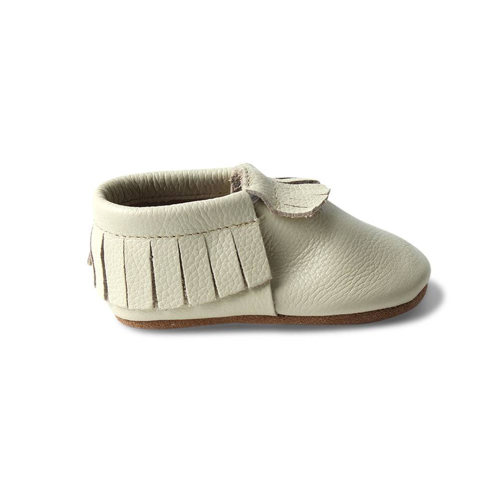 Lace fringe baby shoes — Oatmeal Cookie Baby Fringed Moccasin Shoe on white background