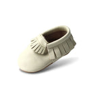 Baby wearing baby shoes — Oatmeal Cookie Baby Fringed Moccasin Shoe
