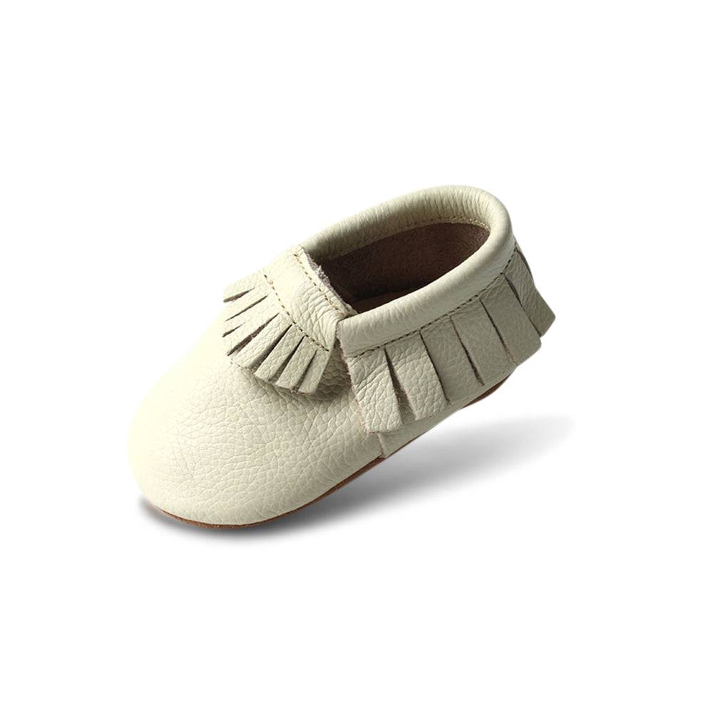 Baby wearing baby shoes — Oatmeal Cookie Baby Fringed Moccasin Shoe