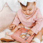 Wisp Pink Leather Baby T Bar Shoe — baby shoes styled flat lay with nursery accessories