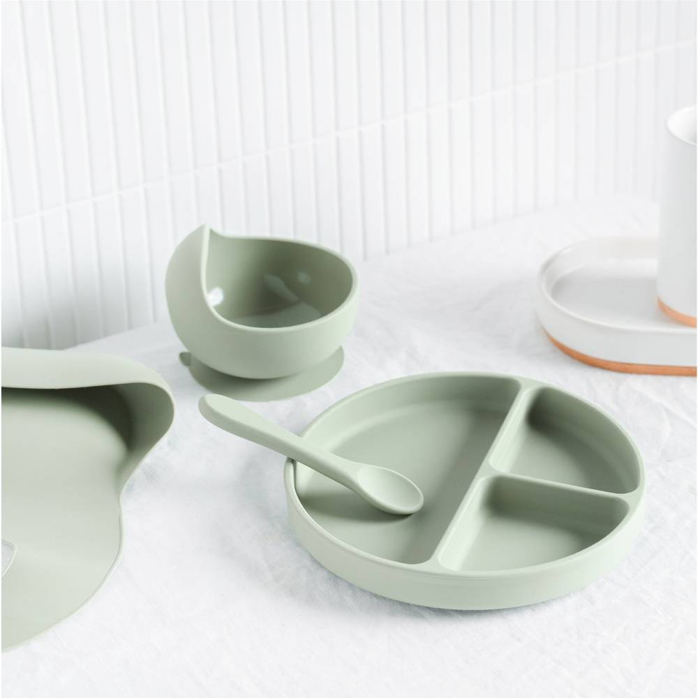 Silicone Baby Feeding Set in Brandy Rose — baby bib styled flat lay with nursery accessories