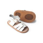Baby feet in baby sandals on soft surface — Snow White Weave Leather Baby Sandal