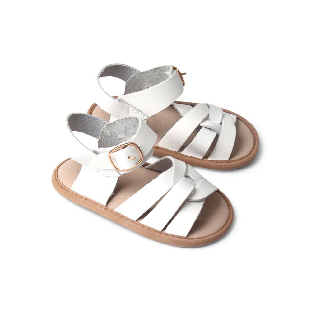 Baby feet in baby sandals on soft surface — Snow White Weave Leather Baby Sandal