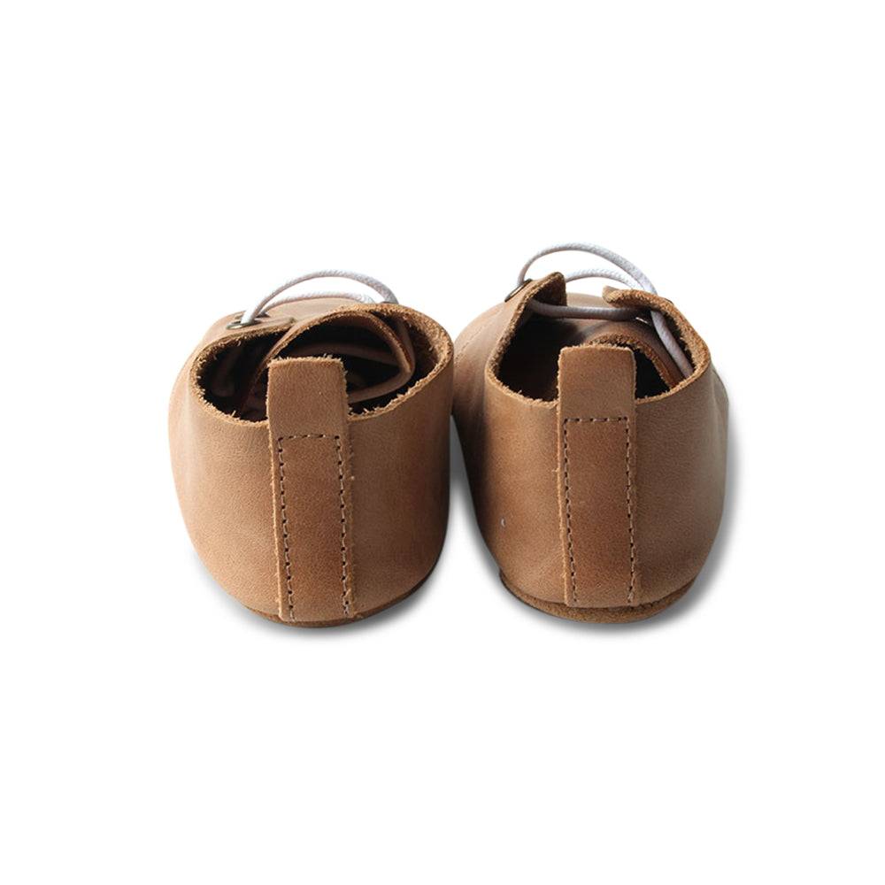 Teddy Baby Lace Up Oxford Bootie — baby booties styled flat lay with nursery accessories