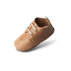 Baby feet in baby booties — Teddy Baby Lace Up Oxford Bootie