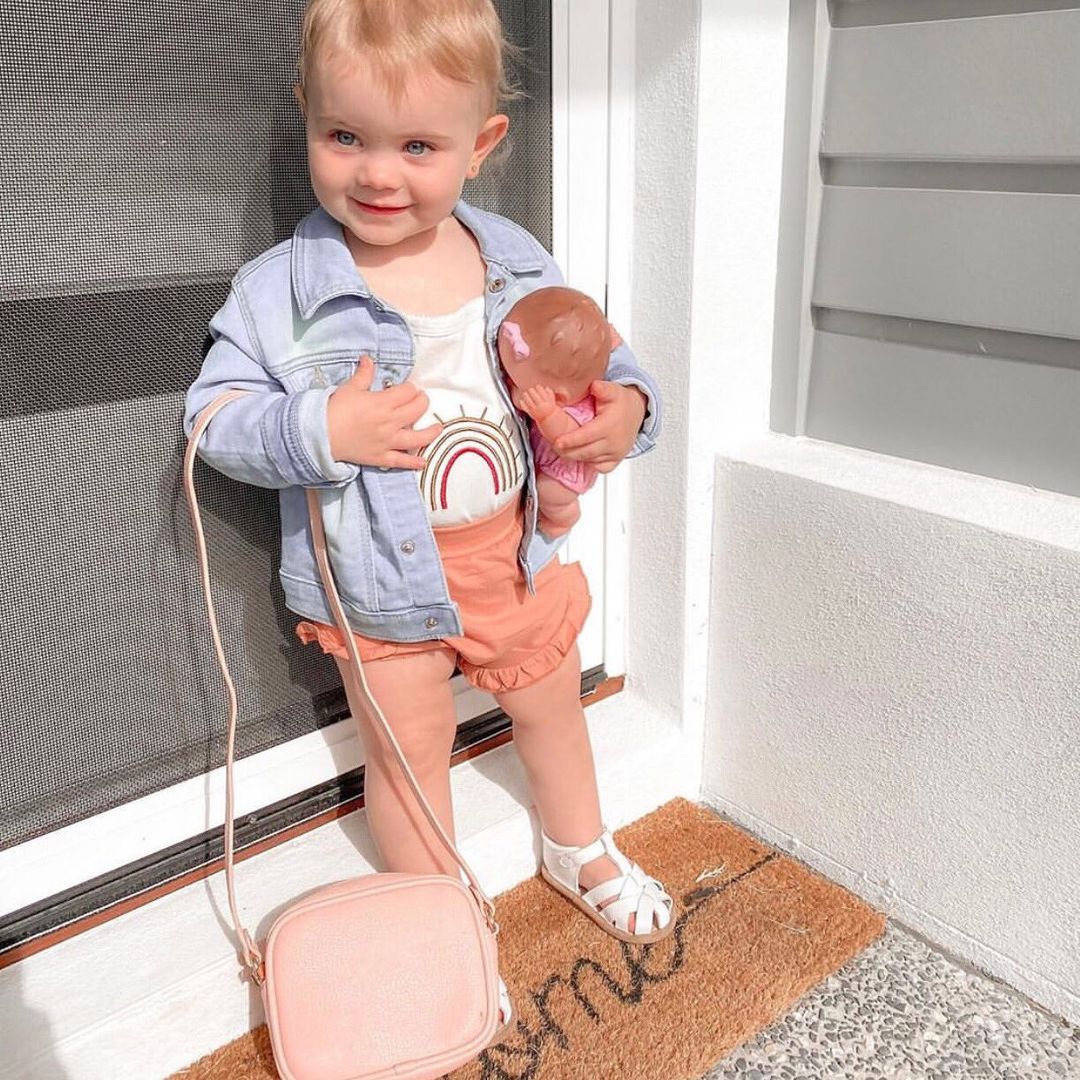 White Leather Baby Sandal — baby sandals styled flat lay with nursery accessories