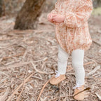 Teddy Baby Lace Up Oxford Bootie — baby booties styled flat lay with nursery accessories