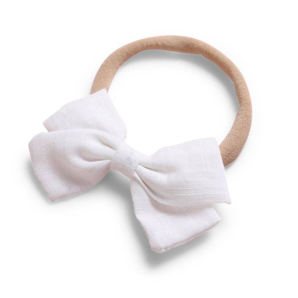 White cotton baby hat — Tinka Tiny Baby Bow on white background