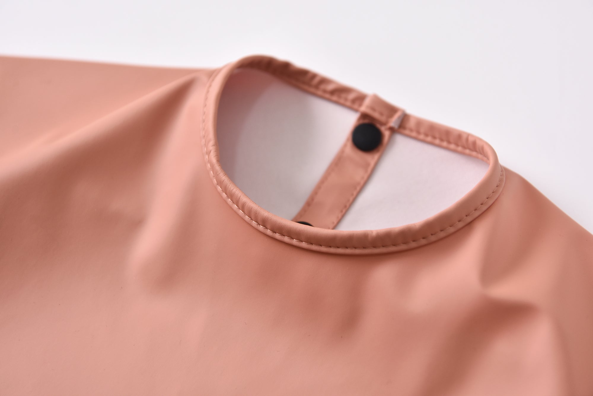 Green Smoke Waterproof Baby Smock Bib Long Sleeve — baby bib styled flat lay with nursery accessories