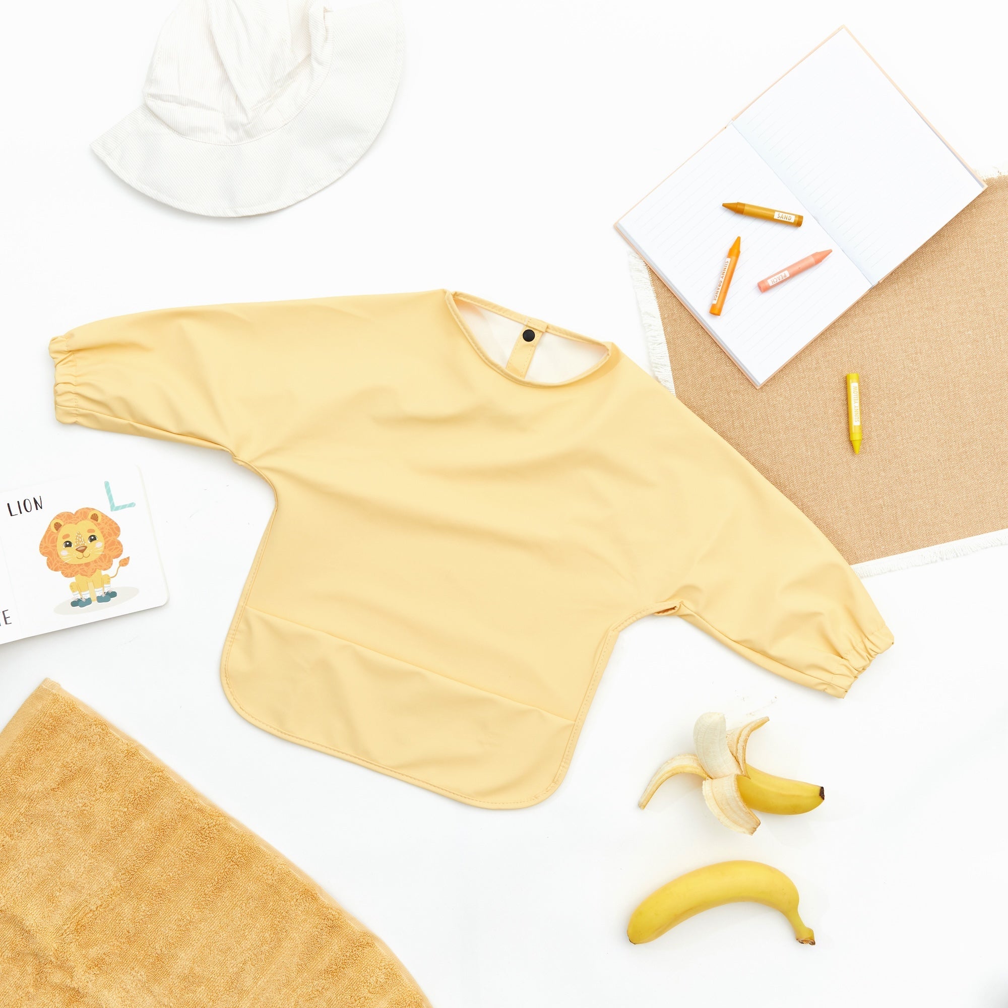 Buttercup Yellow Waterproof Baby Smock Bib Long Sleeve — cat baby bib showing face and soft texture