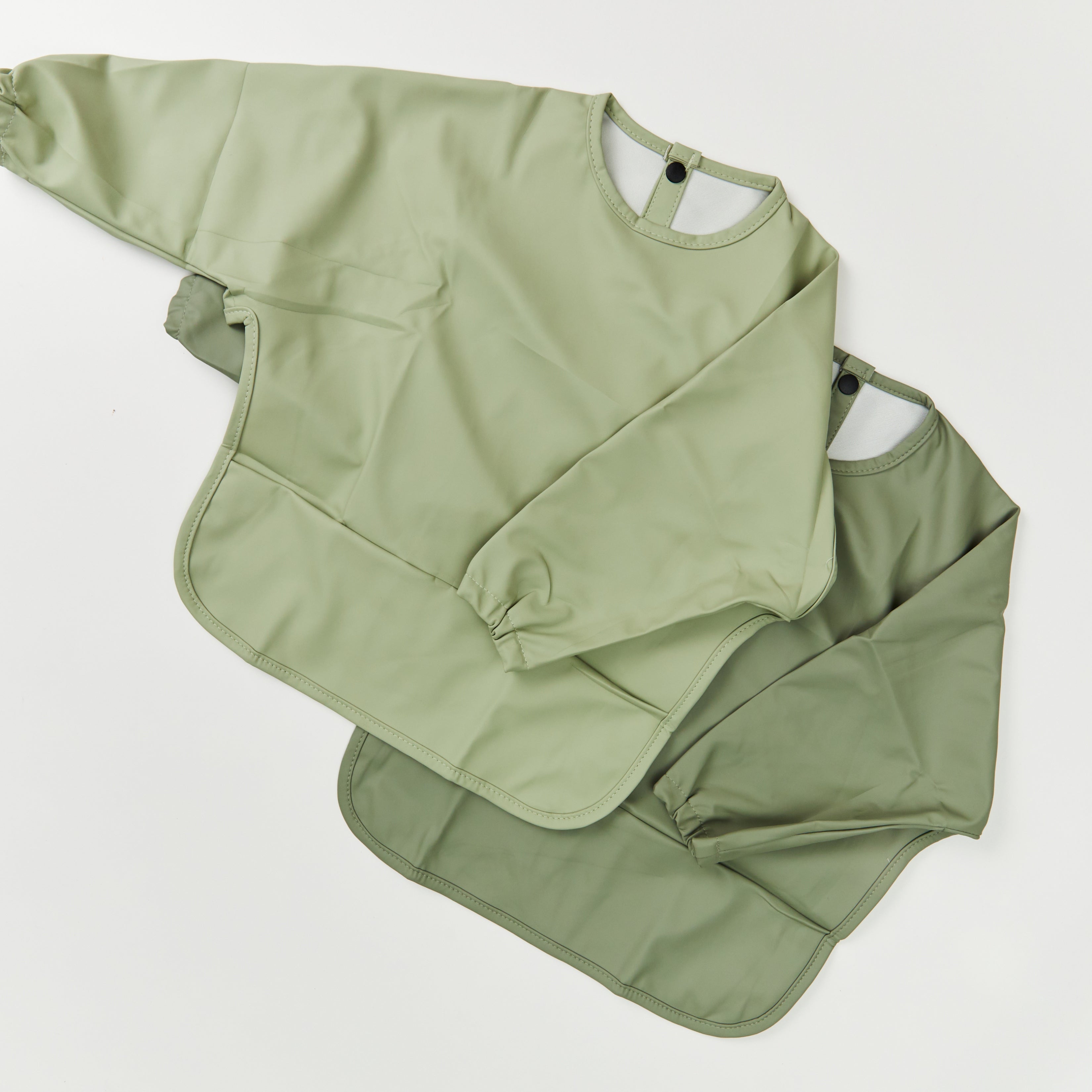 Green Smoke Waterproof Baby Smock Bib Long Sleeve — cat baby bib showing face and soft texture